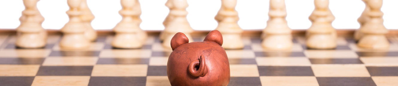 piggy bank on chess board